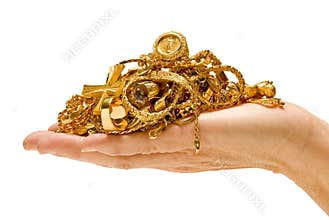 Hand holding gold jewelry