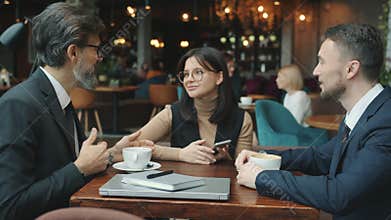 Business men talking discussing deal with interpreter then shaking hands in restaurant
