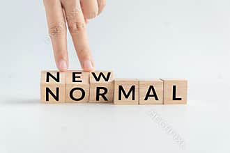 NEW NORMAL word on wooden alphabet cube. the new normal after COVID-19 Coronavirus pandemic concept.