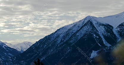 Pan shot of Colorado mountains on gloomy day