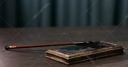 Writing calligraphy. Dip the water level with a brush and ink. The writing tools of Asians. Ancient Asian writing. Asian writing s