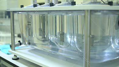 Automatic tablet disintegration and dissolution apparatus. Medication pills testing in laboratory spbas