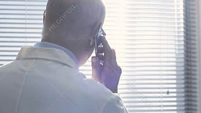 Doctor giving a consultation to a patient on the phone