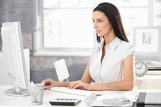 Pretty office worker at desk