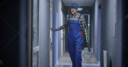 Janitor cleaning a corridor