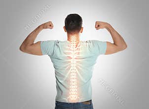 Man with healthy back on background. Spine pain prevention