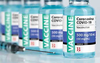 Coronavirus COVID-19 Vaccine Vials and Syringe On Reflective Surface