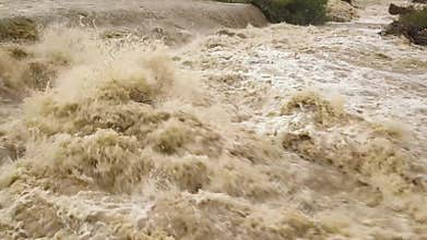 Eide dirty river with muddy water in flooding period during heavy rains in spring.