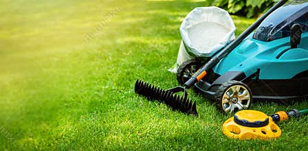 garden lawn care tools and equipment for perfect green grass. copy space