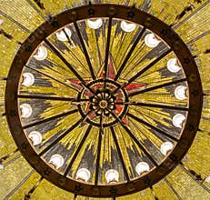 Chandelier and mosaics depicting a Soviet five-pointed star on the ceiling of Komsomolskaya Metro station in Moscow