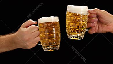 Hands with light beer making toast