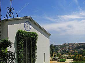 Exterior of Chapelle du Rosaire with distinctive decorative tile figures by the building`s designer, Henri Matisse, Vence, France