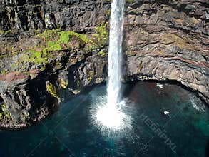 Denmark, Faroe Islands, Vagar Island, Gasadalur, village and waterfall falling into the sea