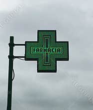 European green cross pharmacy store sign: Farmacia. Pharmacy sign.