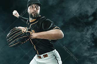 Baseball player with ball. Ballplayer on black background.
