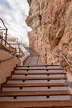 Stairs leading to a hidden coffee bar in caves in Menorca, Spain