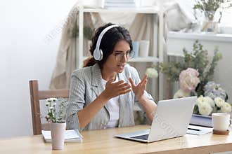 Young creative businesswoman enjoying video call conversation.