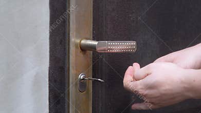 Close up man open door lock with master key