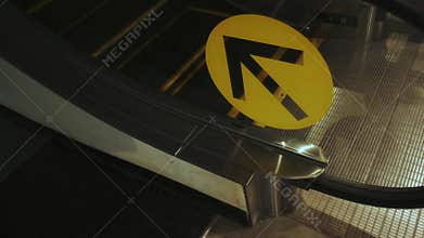 Escalator and arrow sign