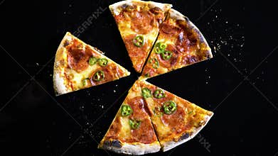Top view of slices of baked pizza, Empty the plate - stop motion animation. Slices of pizza that disappear from the frame. Time la