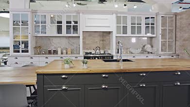 Tracking shot of a luxury kitchen with gray and white classic design