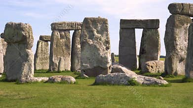 Panning shot of famous prehistoric monument Stonehenge on a beautiful sunny day.