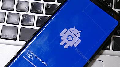 Android robot logo icon on the smart phone screen