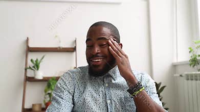 African man talking looking at web cam during job interview