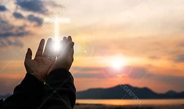 Christian woman praying worship at sunset. Hands folded in prayer. worship god with christian concept religion.