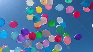 Many colorful balloons flying in the air