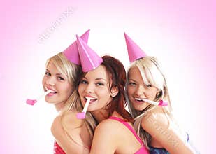 Three young girls are having a birthday party