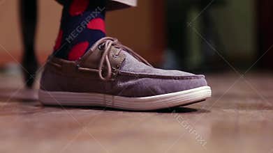 Foot of musician following rhythm on stage