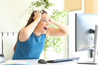 Excited entrepreneur checking computer content