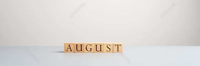 Wooden blocks spelling the word August