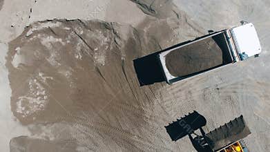 Machines are relocating mineral resources in a top view