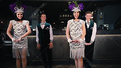 Theme party - Young people in glistening retro clothes dancing using swing elements