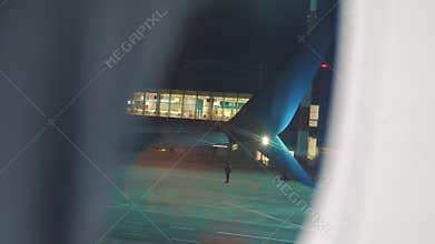 Takeoff airplane aircraft flight concept. the plane taking off at night at the airport strip. the view from the window
