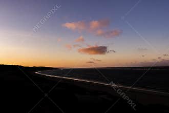 Natural Sunset Sunrise over a beach with birds at the sun, Western australia