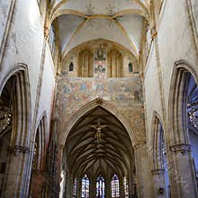 Interior Ulm Minster, main aisle with fresco paintings and Jesus in Ulm Cathedral. Ulmer Muenster, Baden-Wuerttemberg, Germany