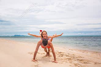 Young friendly family father and dauther are happy in summer Christmas on beach
