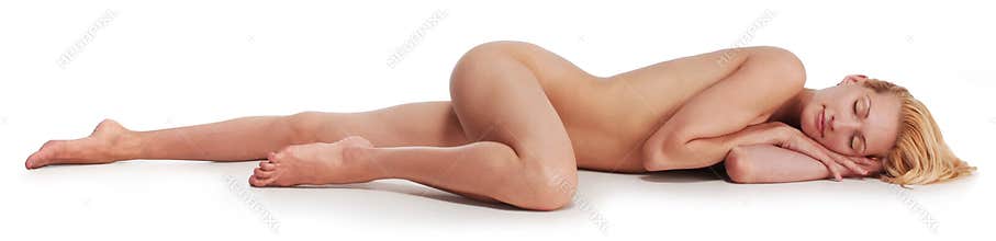 Nude woman relaxing on the floor eyes closed