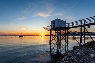 Fishing huts on stilts at sunset in Fouras, Charente-Maritime, France