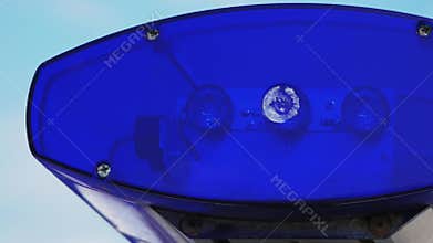 Blinking police blue flashing lights during the day. Police patrol car. Close up