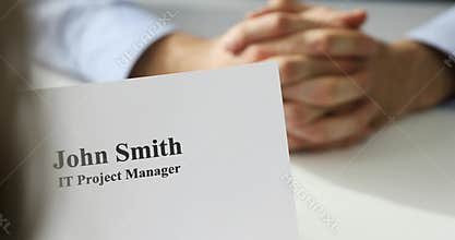 Job interview - recruiter and candidate discussing CV in office