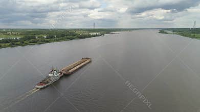 Barge on the river Volga. River shipping.