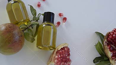 Top view of bottles with pomegranate seed essential oil