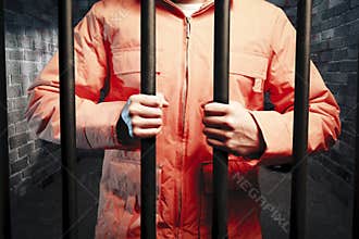 Inmate inside dark prison cell at night
