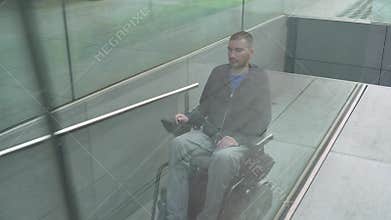 4k resolution follow of a man on electric wheelchair using a ramp. Accessibility concept