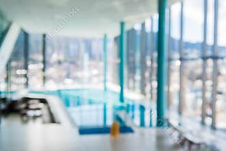 Indoor swimming pool in blur background. Abstract blurry swimming pool in fitness centre.