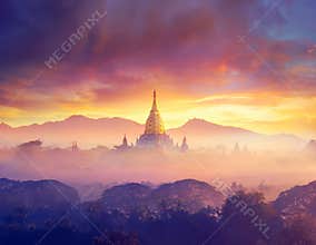 Enjoying colorful sunset over of Buddhist stupas and hot air balloon in the ancient Bagan. Myanmar, Asia